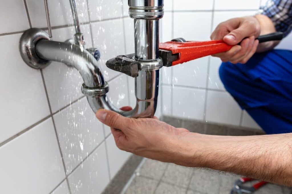 Expert tips to avoid. Plumber fixing leak. plumbing repairs